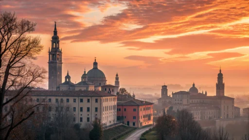 Imagem de um nascer do sol vibrante sobre uma cidade.