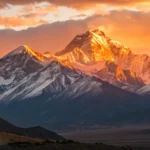 Imagem de um nascer do sol sobre montanhas, simbolizando um novo começo e esperança.